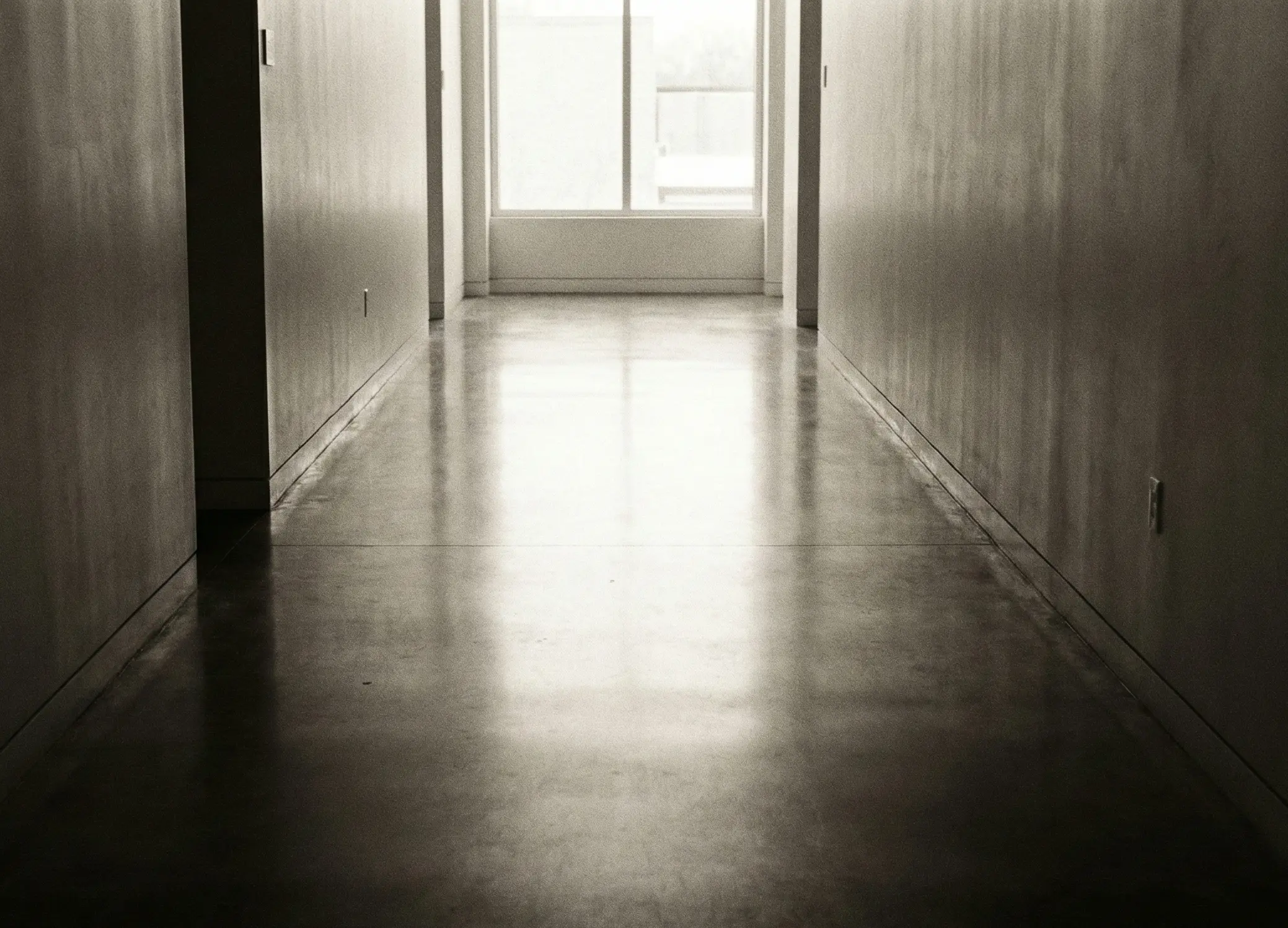 Long hallway with light at the end